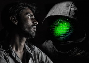 hacker with a web globe on a dark hood. Person frightened by the hacker